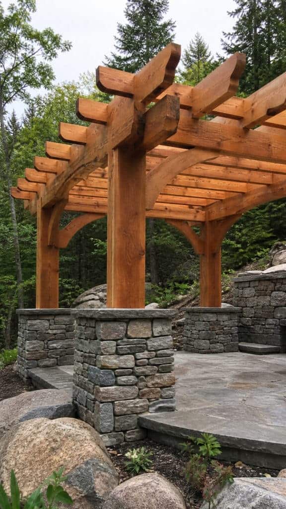 Cedar Log Pergola with Stone Pillars